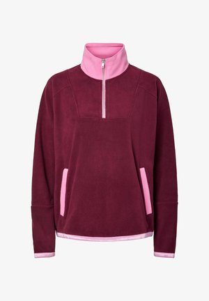 Bordo flis pulover s ružičastim visokim ovratnikom i patentnim zatvaračem, koji ima dva ružičasta bočna džepa i kontrastne manžete. Mekana tekstura.