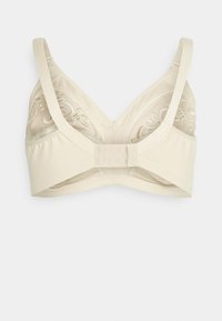 Sujetador beige con tela suave, detalles de encaje translúcido, tirantes ajustables y cierre de gancho y ojo en la parte trasera. El patrón floral adorna las copas.