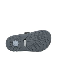 Soletta di scarpa in gomma grigia con un motivo di battistrada testurizzato, caratterizzata da un logo circolare, supporto moderato dell'arco e un design robusto e flessibile.