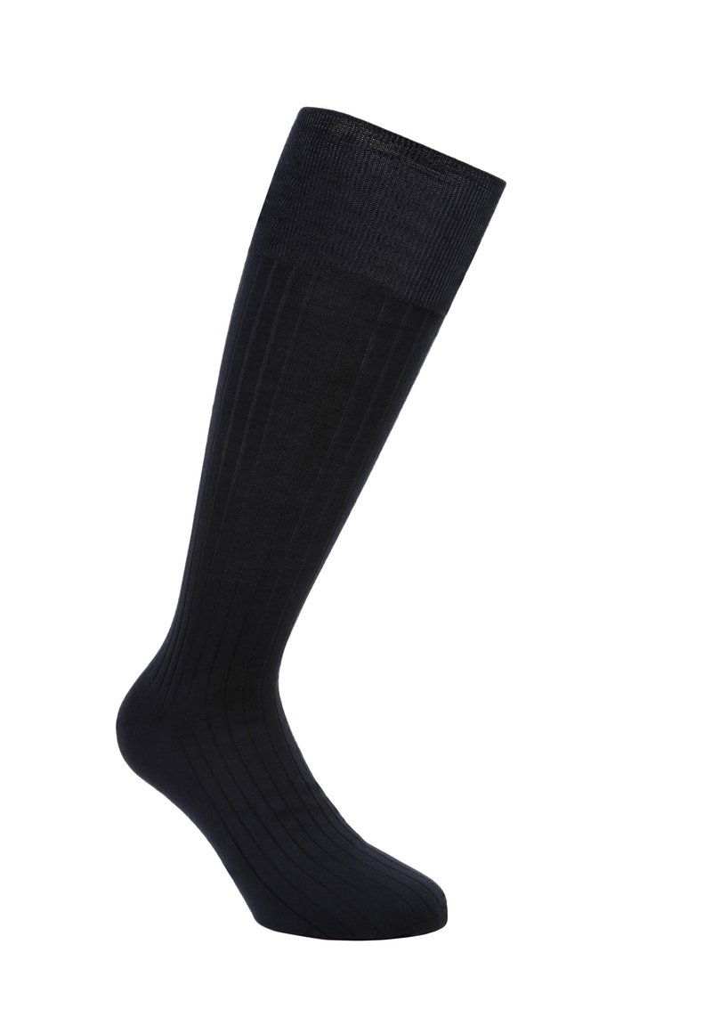 Calze nere fino al ginocchio con una texture a coste, realizzate in un materiale morbido. Presentano un colore uniforme e un design affusolato per una vestibilità aderente.