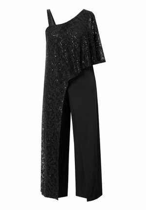 Body nero con una sovrapposizione in pizzo trasparente e a strass sul lato sinistro e un design di pantaloni neri solidi e larghi. Una spallina.