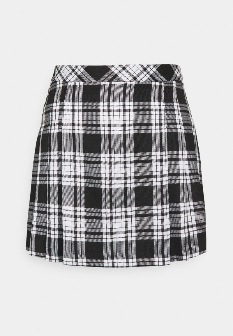 Jupe plissée à carreaux noir et blanc avec une taille haute, présentée à plat sur un fond gris clair.