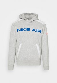Gray hoodie with blue "NIKE AIR" logo, white accents on shoulders, front kangaroo pocket, ribbed cuffs, and hem. Soft, textured fabric.
