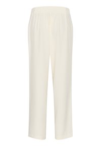 Crème-kleurige, lichte stoffen broek met een elastische tailleband, tapering pijpen, een gladde textuur en zonder zichtbare patronen of accenten.