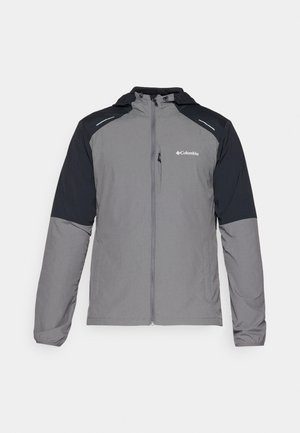 Chaqueta gris con mangas negras, cierre frontal, capucha y logo de Columbia. Cuenta con acentos reflectantes y un tejido ligero y texturizado.