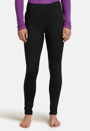 Svarta leggings med hög midja, tillverkade av stretchigt tyg. Slät yta och kroppsnära design som sträcker sig ner till anklarna.