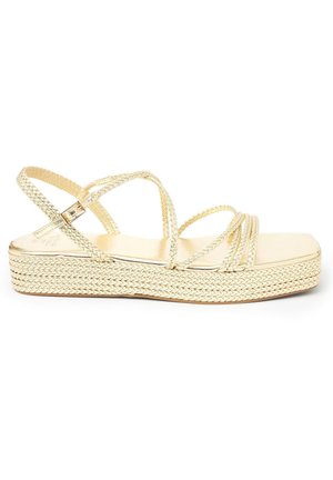 Gold braided platform sandal with multiple thin straps and a side buckle closure on a white background.