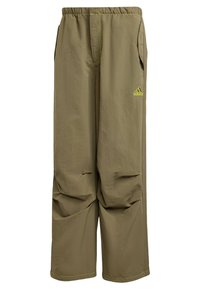 Khaki cargo pants with an elastic waistband, featuring side pockets and contrasting yellow stitching. Adidas logo on the left thigh.