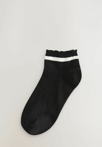 Zwarte enkelsok met een gekant-edged manchet, voorzien van een witte streep. Gemaakt van een gladde, rekbare stof met een ronde teen.
