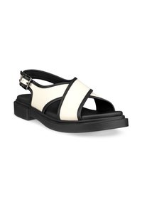 Black and white slingback sandals with a matte finish, featuring cross straps and a chunky sole. Buckle detail at the ankle.