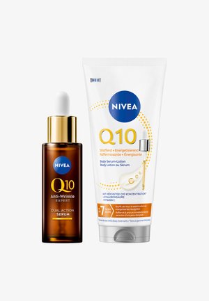NIVEA Q10 Anti-Wrinkle Expert dual action serum in a brown glass bottle with a white dropper, alongside a white tube of body serum-lotion.