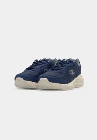 Navy blue sneakers with mesh and synthetic material, featuring a light gray accent, laces, and a textured white outsole.