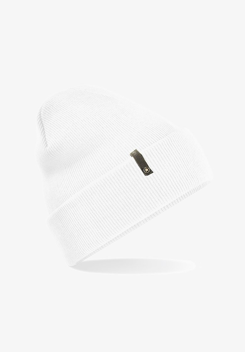 White ribbed knit beanie with a folded cuff and a small black tag featuring a star emblem. Soft texture with a snug fit.