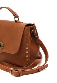 Brown faux leather handbag with rounded shape, gold hardware accents, and studded detailing along one side. Includes a detachable strap.