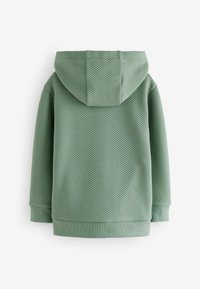 Bluza z kapturem z fakturowanej tkaniny w jasnym zielonym kolorze, z wytłaczanym wzorem w romby, ściągaczami na rękawach oraz zaokrąglonym dołem.
