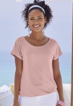 Light pink short-sleeve shirt with a scoop neckline, featuring a soft texture. Paired with white pants and accessories in pastel colors.