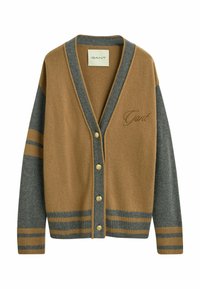 Gilet en mélange de laine marron et gris, avec un col en V, cinq boutons, des poignets côtelés et des accents rayés aux manches et à l'ourlet. Logo GANT brodé.