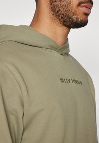 Helly Hansen CORE - Sudadera - green