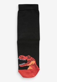 Schwarze Socken mit einem roten und orangenen Dinosaurier-Motiv an der Zehe. Der Stoff wirkt glatt mit einem gerippten Muster am Bündchen.