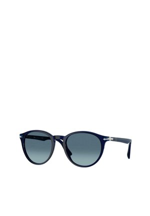Lunettes de soleil à monture ronde bleu foncé avec verres gris dégradés et détails argentés sur les branches, présentées sur un fond blanc uni.