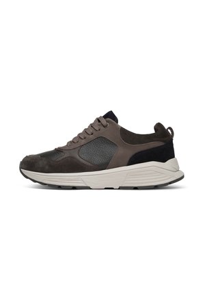 Low-top sneaker in dark brown and black with textured panels, lace-up front, padded collar, and thick white sole.