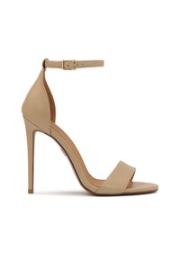 Beige high-heeled sandal with a glossy finish, open toe, and single ankle strap featuring a gold-toned buckle. Sleek design and minimalistic style.