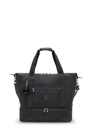 Black duffel bag with top handles and adjustable shoulder strap. Made of textured fabric with a zippered front pocket and round logo detail.