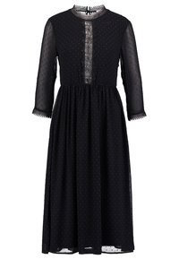 Schwarzes langärmliges Kleid aus durchsichtigem Stoff mit kleinem Punktmuster, hohem Kragen und Spitzeinsätzen entlang der Vorderseite und Ärmel.