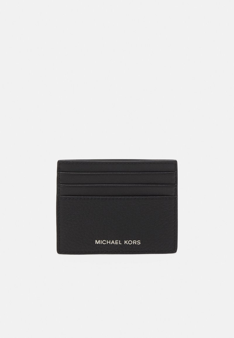 Porte-cartes en cuir noir avec plusieurs emplacements pour cartes, finition texturée et logo "MICHAEL KORS" en relief à l'avant.