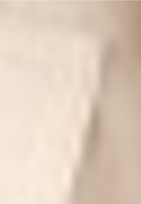 Beżowa tkanina o fakturowanej powierzchni, miękka w dotyku, z subtelnym wzorem i lekko nieregularnymi krawędziami. Nadaje się do tapicerki lub zasłon.