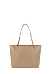 Beżowa torba typu tote z faux skóry z dwoma długimi uchwytami i okrągłym, ozdobionym ćwiekami wzorem na froncie. Gładka faktura i usztywniony kształt.