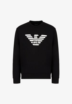 Felpa nera in cotone, con logo di un'aquila bianca e righe orizzontali. Collo a giroclassico e maniche lunghe. Texture morbida.