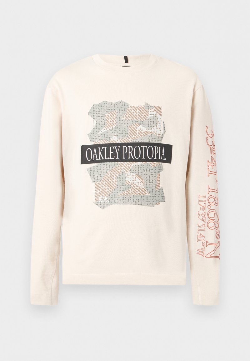 Beige long-sleeve shirt with abstract camouflage print and "OAKLEY PROTOPIA" text on front, red coordinates printed on right sleeve.