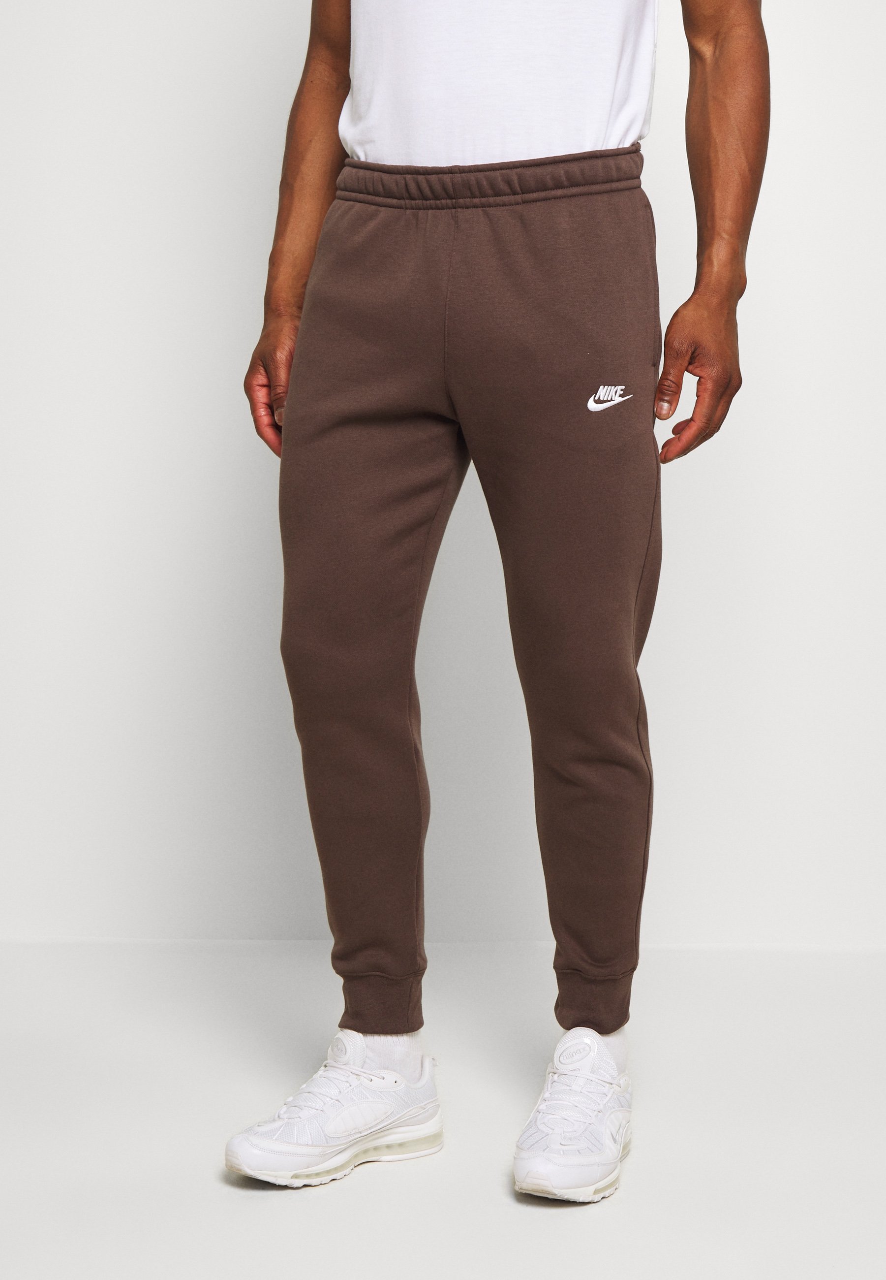 brown nike track suit