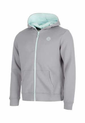 Hellgrauer Kapuzenpullover mit Reißverschluss, Fronttaschen, gerippten Bündchen und hellblauer Innenkapuzenfutter und Reißverschluss. Kleines weißes Logo auf der Brust.