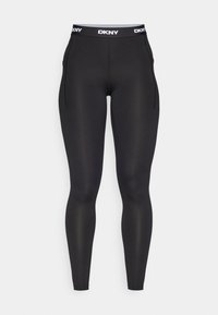 Leggings da performance neri con elastico in vita con logo DKNY, realizzati in un tessuto morbido e elastico. Presentano cuciture laterali e una silhouette aderente.