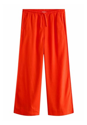 Pantalon large orange vif avec taille élastique et cordon, avec poches latérales, présenté sur fond blanc.