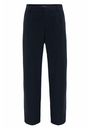 Marineblauwe, op maat gemaakte broek van glad stof. Voorzien van een rits aan de voorkant, schuine zijzakken en een ontspannen pasvorm met rechte pijpen.