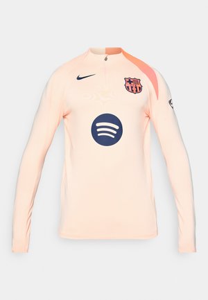 Jersey pêche à manches longues avec un col zippé moitié, présentant un logo bleu marine et un marquage Spotify sur le devant, fabriqué en tissu extensible.