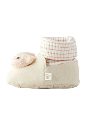 Beige, mysig toffel med en mjuk, stickad fåransikte detalj på tåspetsen och en ribbad, rutigt manschett. Texturerad sula med björn-mönster.