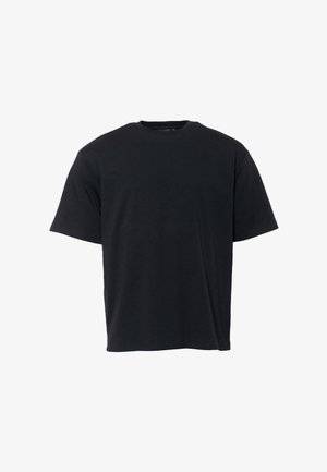 Fekete, rövid ujjú, pamut póló. Klasszikus környakú fazonnal, laza illeszkedéssel és minimalista márkázással az elején.