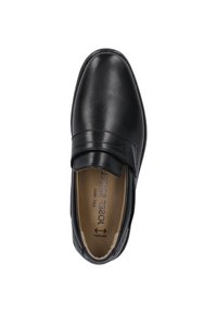 Musta nahkainen liukupohjainen kenkä, jossa on sileä pinta, brodeerattu yksityiskohta ja pehmustettu pohja mukavuutta varten. Tasainen väri ilman kuvioita.