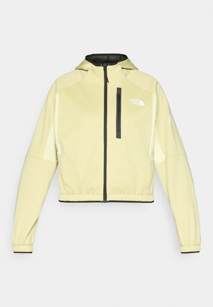 Light yellow cropped jacket with a hood, front zipper, and black accents. Features long sleeves and a zippered pocket on the chest.