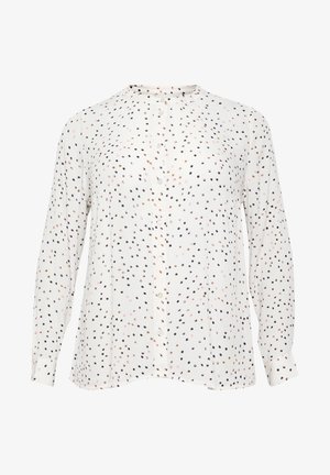 Koszula z długim rękawem z lekkiego materiału, w białym tle z czarnym, różowym i brązowym wzorem w kropki, z zaokrąglonym kołnierzykiem.