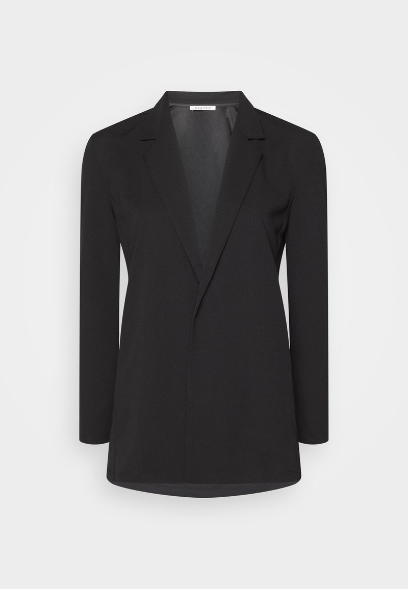 Blazer noir pour femme, cintré, à manches longues, col à revers cranté, et coupe ouverte, sur un fond clair uni.