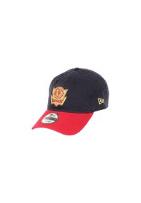 Navy blue cap with a red brim, featuring an embroidered logo in gold. Made of fabric, with ventilation eyelets on the top.