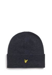 Mørkeblå ribbestrikket lue med brettet brem, med en liten gul fuglelogo brodert på fronten. Myk tekstur.