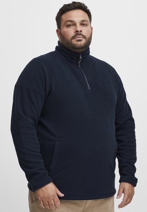 Moška temno modra flis pulover s visokim ovratnikom, polovičnim zadrgo spredaj in stranskimi žepi; mehak material z enostavnim in enobarvnim dizajnom.