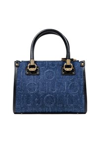 Sac en denim avec logo en relief, accents en cuir noir, poignées rondes doubles, forme rectangulaire et quincaillerie dorée.
