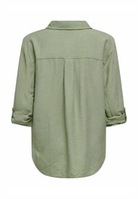 Lichtgroen, shirt met lange mouwen en een kraag, met opgerolde mouwen en een achterste plooi. Glad textuur en afgeronde zoomontwerp.